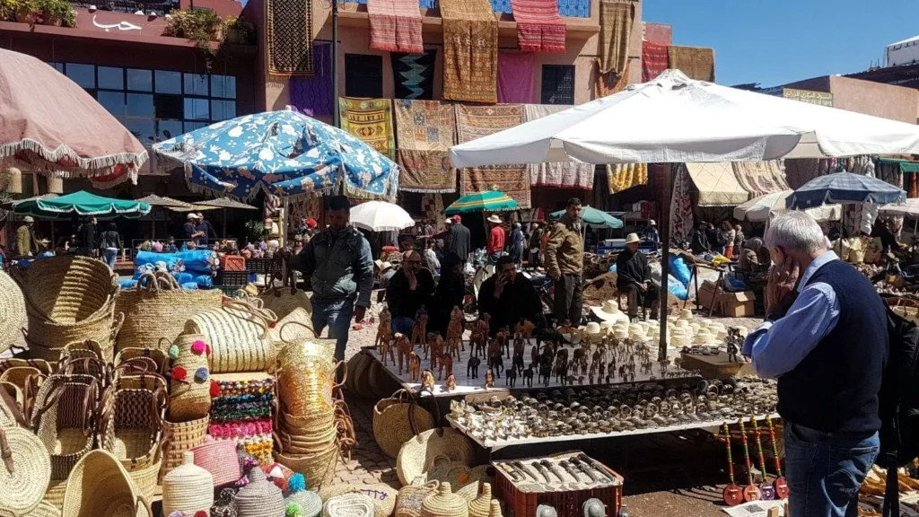Local artisans and vendors selling handcrafted goods at an open-air market in Marrakech