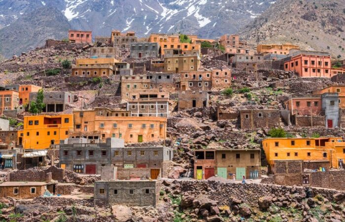Colorful Berber village built on the hillside of the High Atlas Mountains in Morocco