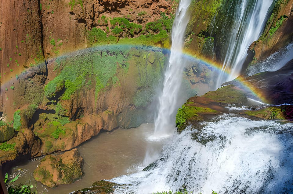 Ouzoud Waterfalls in Morocco surrounded by lush greenery and cliffs