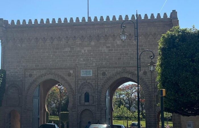 Historic city gate in Rabat with Moroccan flag