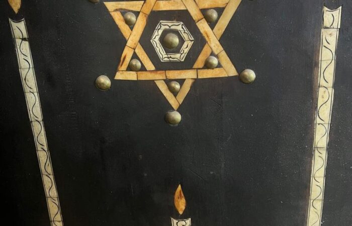 Star of David carving on a wooden panel in a Marrakech synagogue, featured on the Jewish Heritage Tour