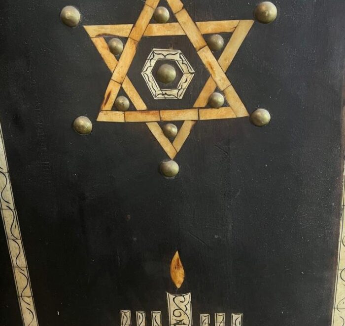 Star of David carving on a wooden panel in a Marrakech synagogue, featured on the Jewish Heritage Tour