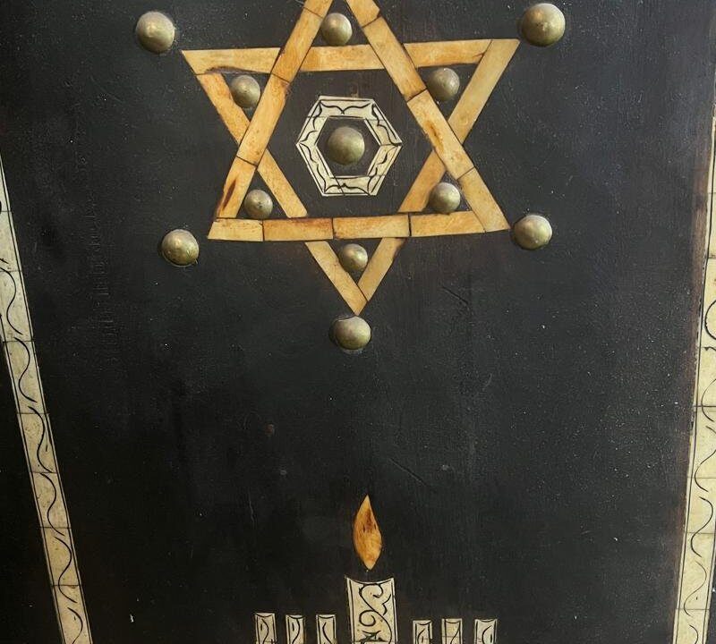 Star of David carving on a wooden panel in a Marrakech synagogue, featured on the Jewish Heritage Tour